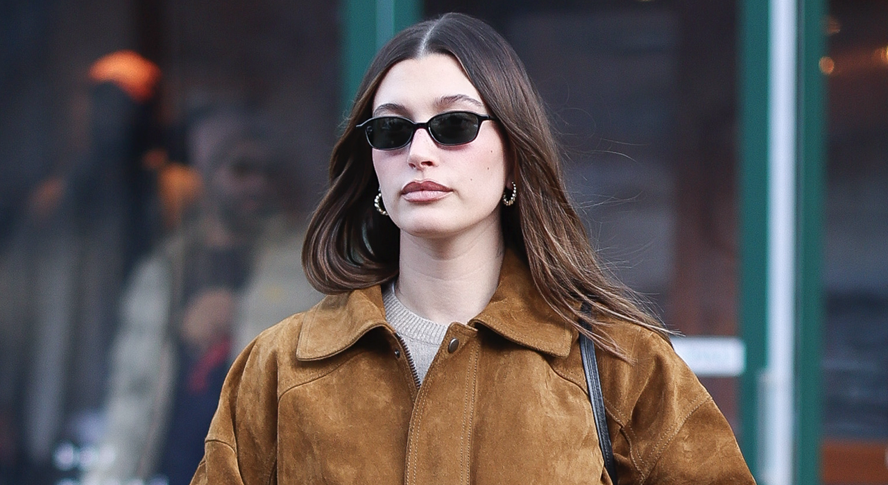 Hailey Bieber seen in SoHo on January 30, 2025 in New York City wearing a brown suede jacket and the row bag