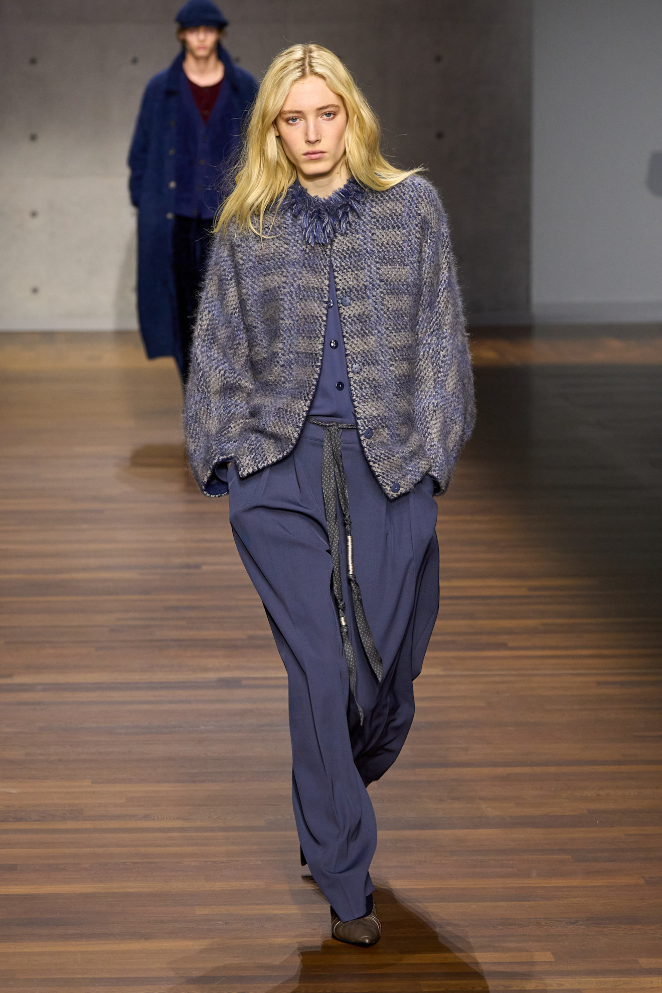 Model wears a frothy collar on the A/W '26