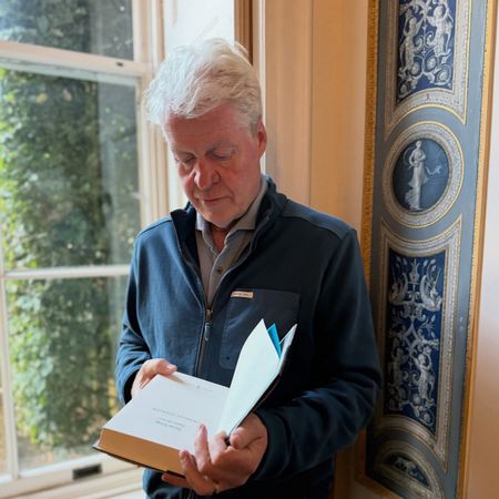 Earl Spencer reading a book