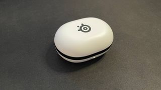 SteelSeries Arctis GameBuds gaming earbuds inside charging pod case