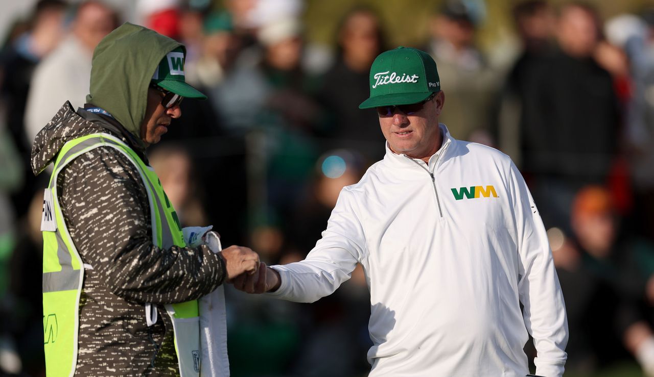 Charley Hoffman fist pumps his caddie