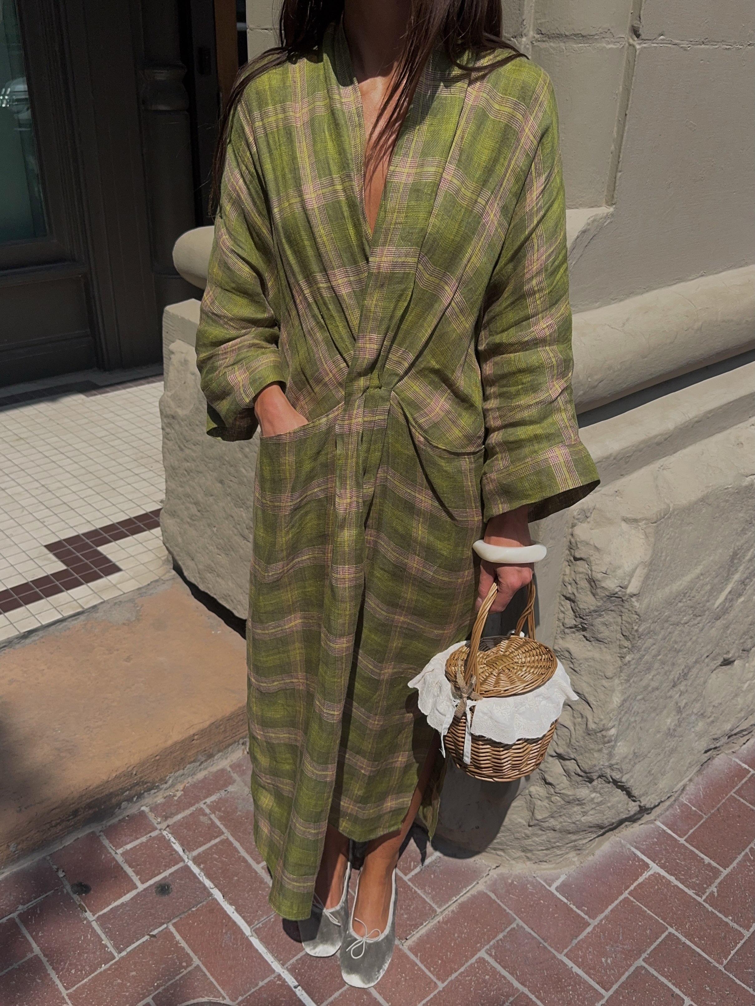 An image of @makenna_alyse wearing a kaftan with silver ballet flats.