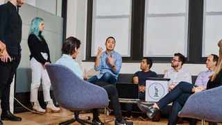 Whitepaper from IBM on how to create the ideal personalization, with image of colleagues in a meeting