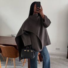 Influencer wearing a scarf coat with jeans