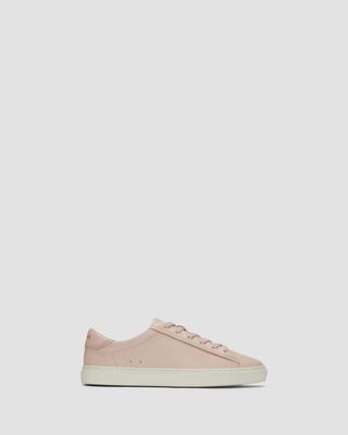 Everlane Day Sneaker on a plain backdrop in a guide to the best work sneakers 2024