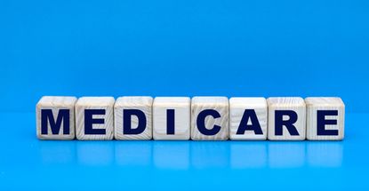 concept word medicare on cubes on a blue background