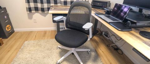 The Haworth Breck office chair in front of an L-shaped desk