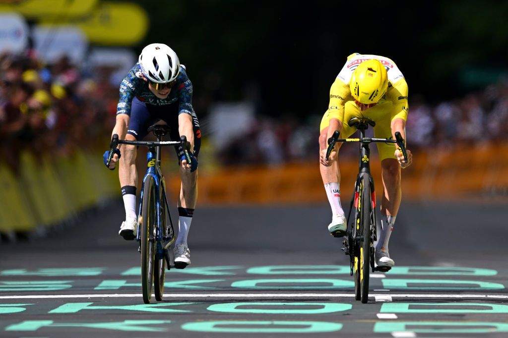 LELIORAN FRANCE JULY 10 LR Jonas Vingegaard Hansen of Denmark and Team Visma Lease a Bike and Tadej Pogacar of Slovenia and UAE Team Emirates Yellow Leader Jersey sprint at finish line to win the stage during the 111th Tour de France 2024 Stage 11 a 211km stage from EvauxlesBains to Le Lioran 1239m UCIWT on July 10 2024 in Le Lioran France Photo by Dario BelingheriGetty Images