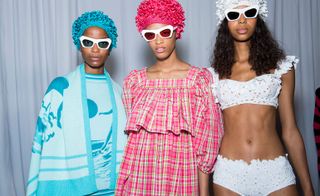 Models wear ruffled checked dress with lace swimsuit, blue knit cape and dress and colour-matching head pieces