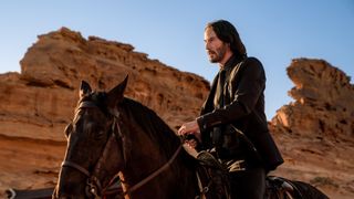 Keanu Reeves as John Wick, on a horse, in John Wick: Chapter 4