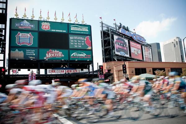 The peloton scoots on by the local basball stadium.