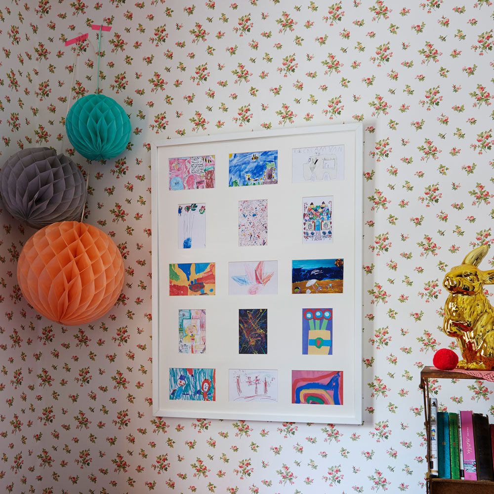 colourful bedroom with hanging picture frame
