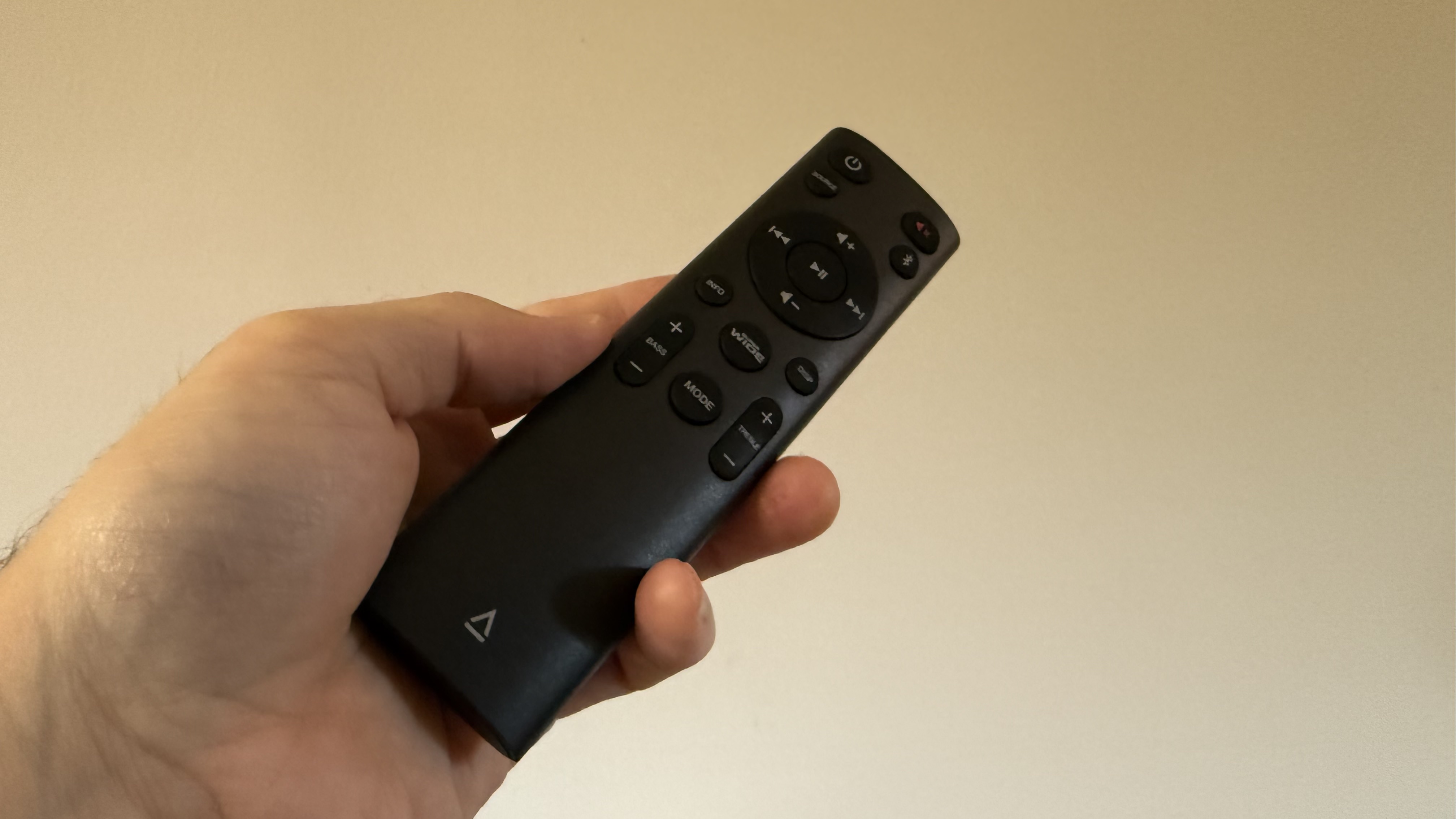Creative Stage Pro remote control held in hand