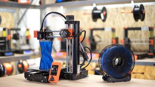 Prusa Mini+ 3D printer on work bench