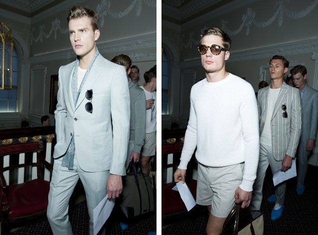 Guys wearing Gieves &amp; Hawkes S/S 2015 collection. On the left the guy is wearing a chalky white suit with a light blue scarf, white t-shirt and sunglasses in his pocket. On the right the guy is wearing a white knitted jersey, chalky white shorts and sunglasses.