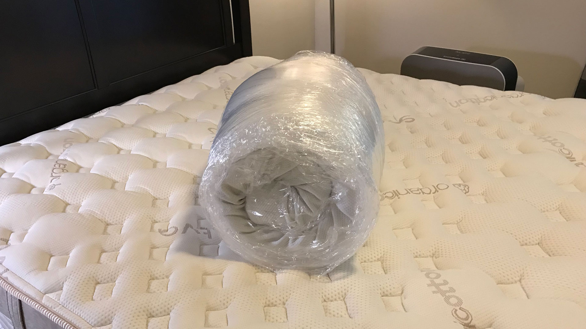 A Tempur-Pedic TEMPUR-Adapt Mattress Topper in its shrink wrap