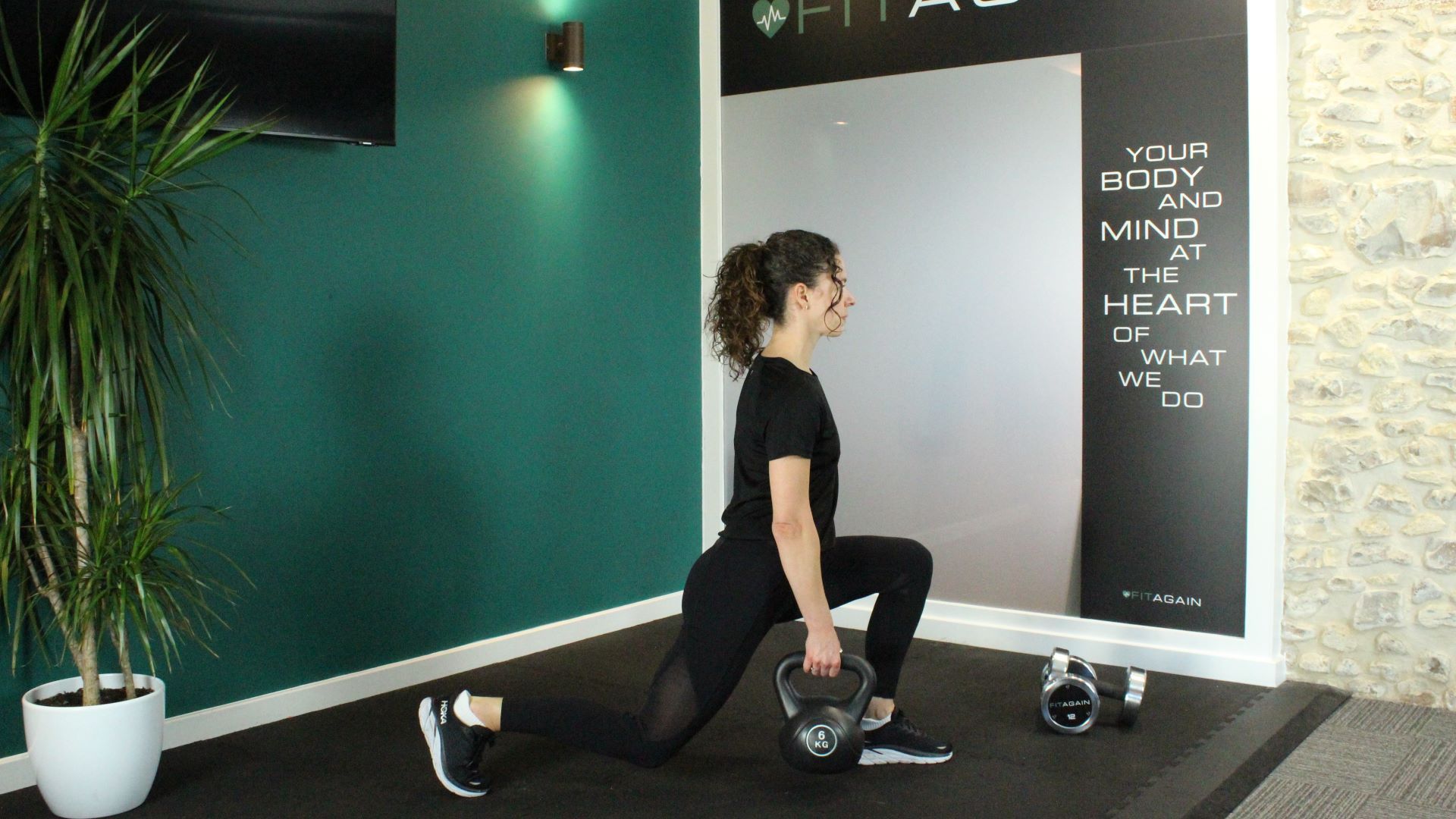 Personal trainer Alanah Bray demonstrates a split squat