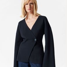 Woman wearing navy wrap cardigan