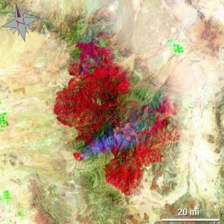 This Landsat 5 satellite image of the Horseshoe 2 Fire in southeastern Arizona was taken on June 15, 2011 at 19:54:23 Zulu (3:54 p.m. EDT). This false-colored image uses a 7, 4, 2 band combination and shows the burn scar in red the fire ongoing in really bright red, vegetation is green, smoke is blue and bare ground is tan.
