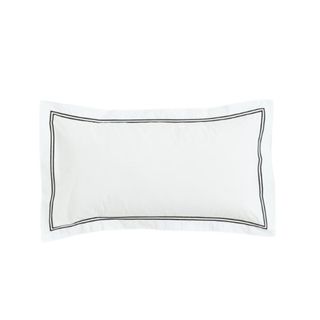 A white pillowcase with a black trim