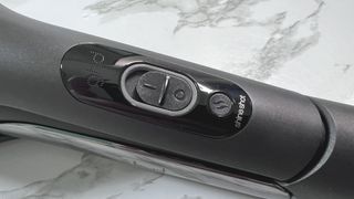 Control switch on GHD Duet Style hair styler