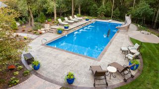 How to add value to your home: Large swimming pool and patio in a secluded back yard.