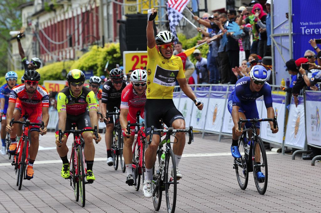 Race leader Ryan Gibbons (Dimension Data) celebrates victory