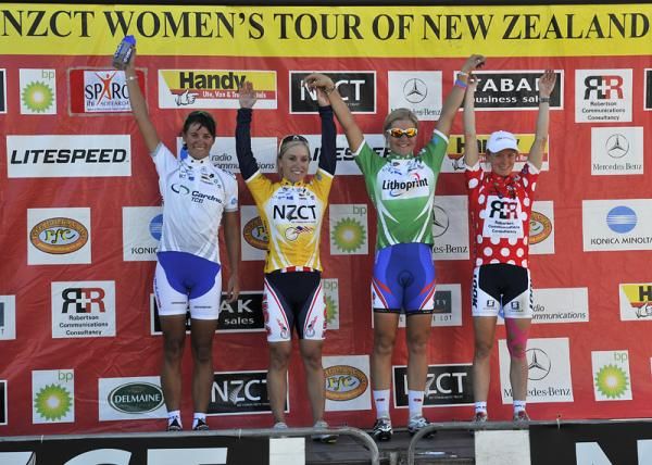 The jersey wearers celebrate on the podium