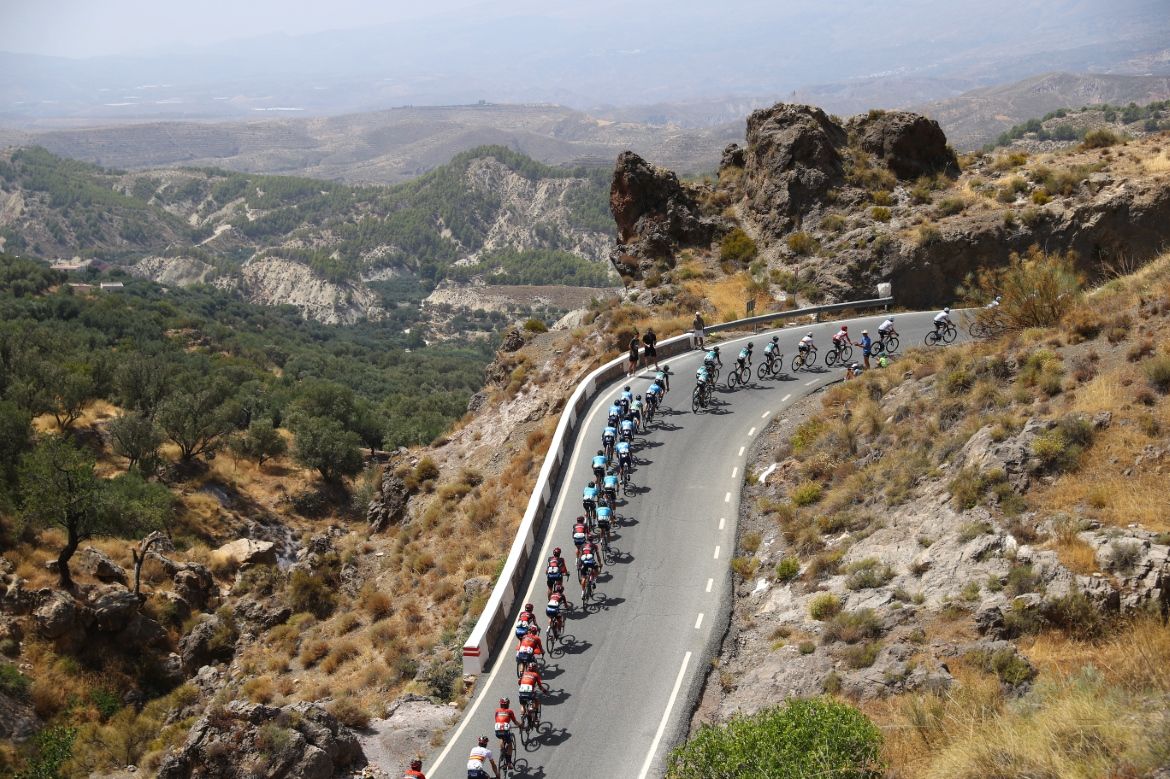 The peloton snakes uphill