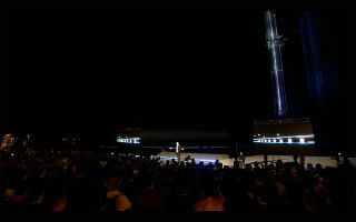 SpaceX CEO Elon Musk addresses a crowd of employees, local officials, invited guests and members of the media while standing before a fully-stacked Starship at the company's South Texas Launch Site, Starbase, on Feb. 10, 2022.