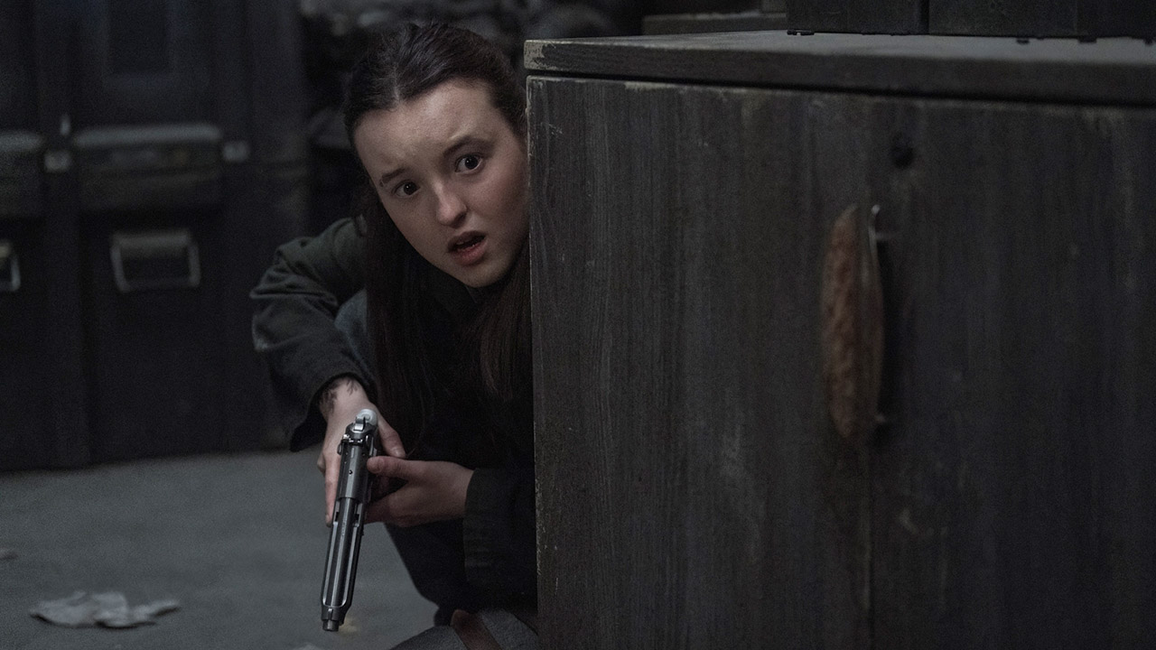 Ellie looking worried from behind a cupboard in The Last of Us season 2 episode 4