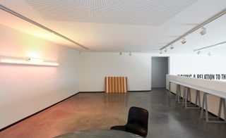 interior with art in display at the modernist white painted and crips Fondation CAB in the south of France