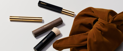 Merit make up products coming out of a bag
