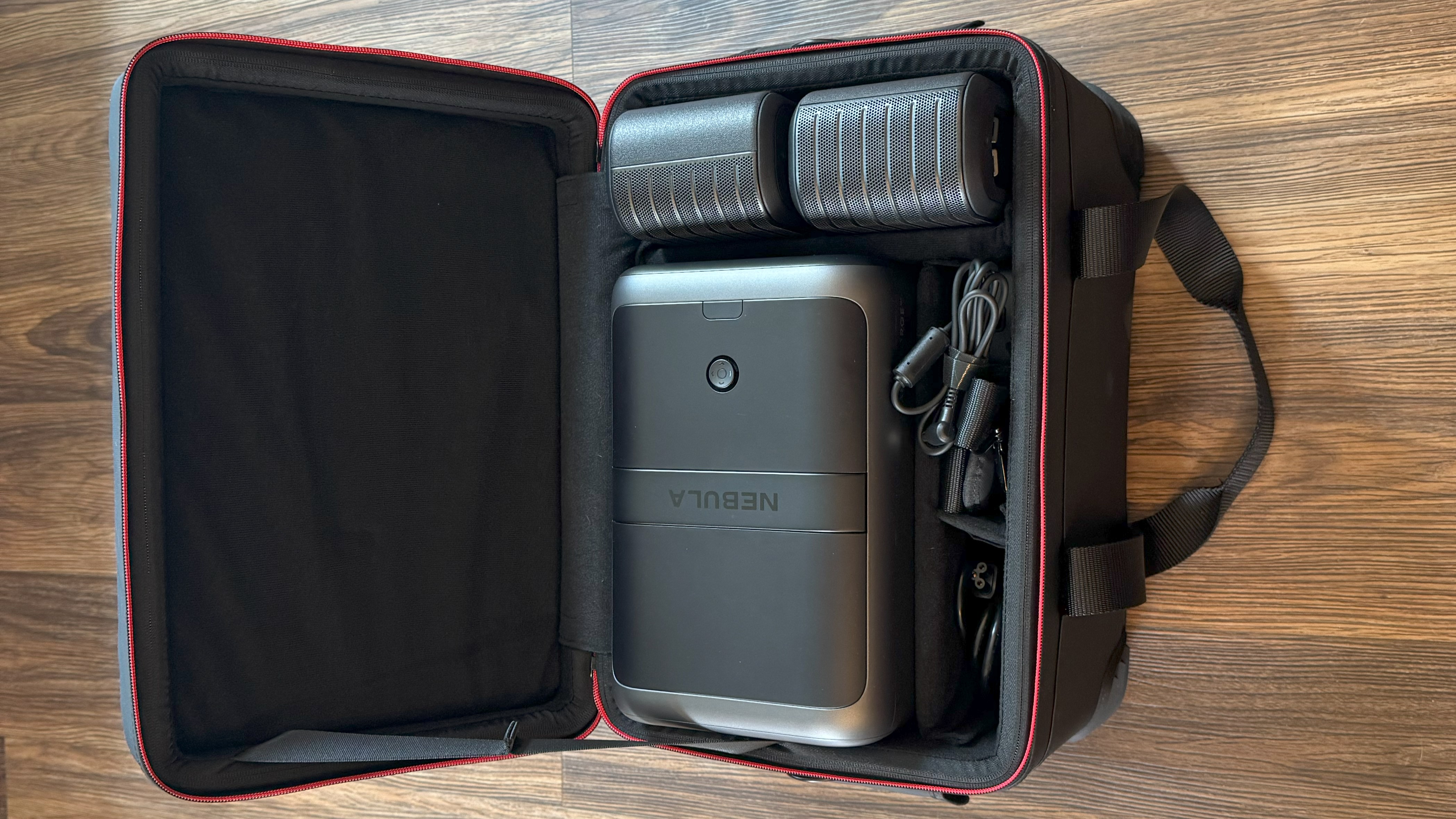 Anker Nebula X1 in carrying case with speakers