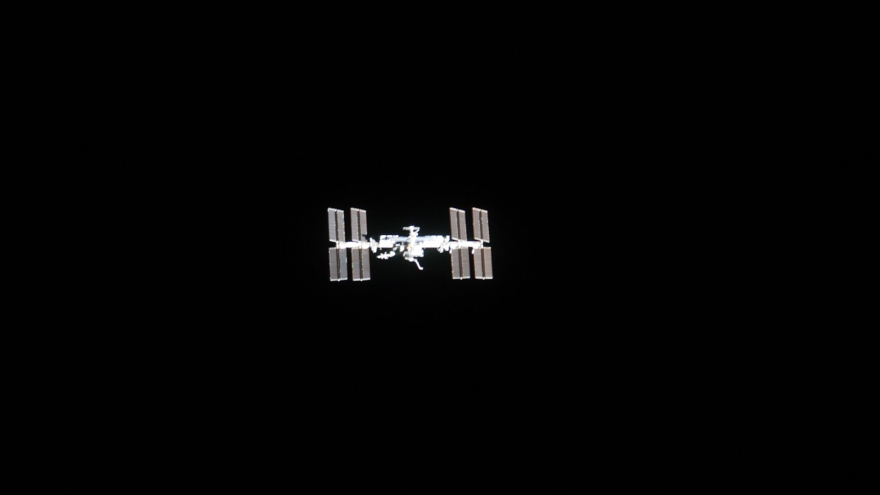 long-range view of the international space station in space