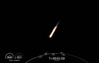 A SpaceX Falcon 9 rocket launches on its 11th mission, a record for a single booster, carrying 52 Starlink internet satellites into orbit from Vandenberg Space Force Base in California on Dec. 18, 2021.