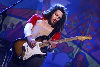 Red Hot Chili Peppers guitarist John Frusciante performs on the east stage Saturday at Woodstock '99 in Rome, New York at Griffiss AFB Park for the 30th Anniversary Concert. They are among over 45 bands performing on one of four stages July 23-25.