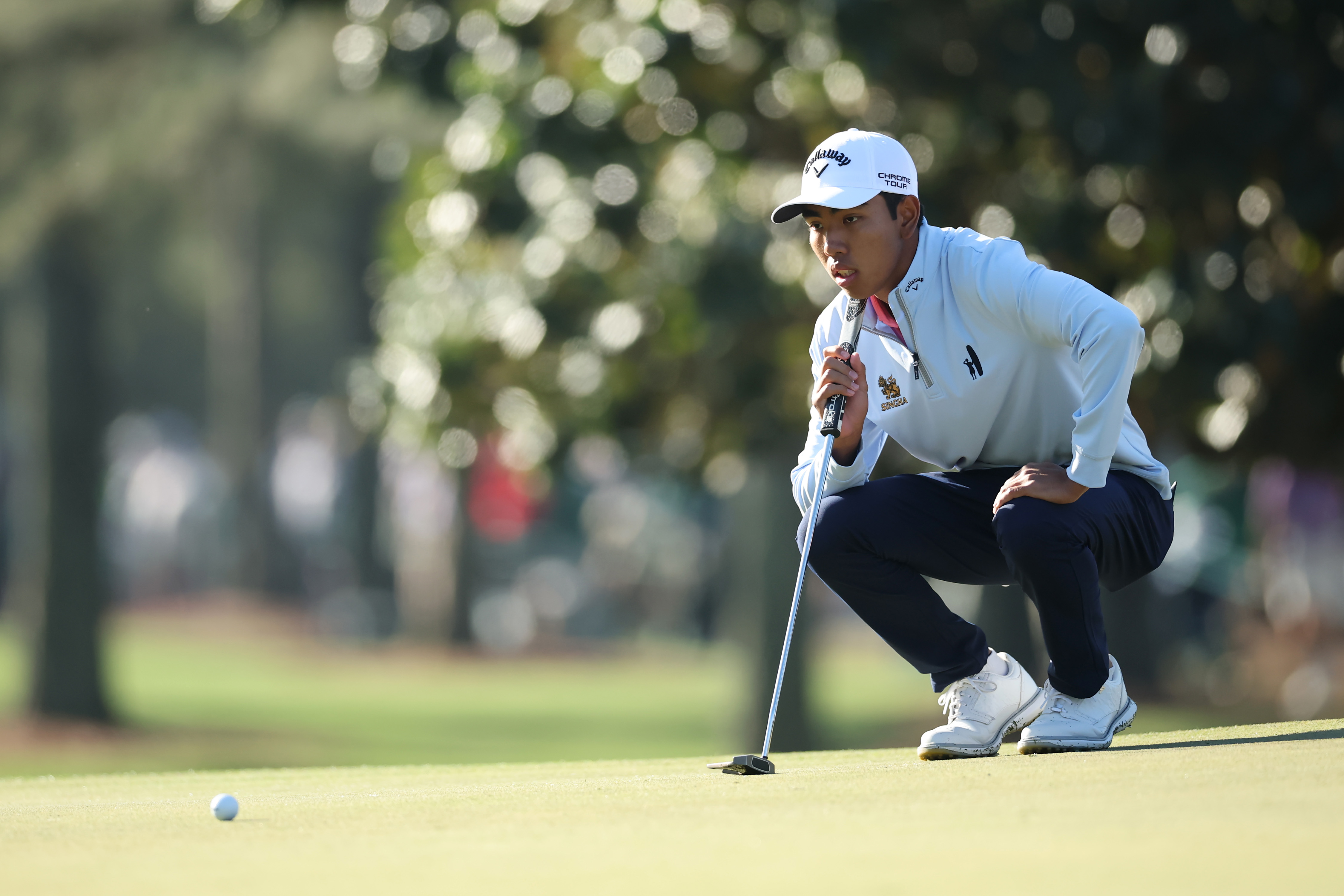 Amateur Fifa Laopakdee of Thailand looks over a putt on the first hole during the second round of the 2026 Masters Tournament at Augusta National Golf Club on April 10, 2026 in Augusta, Georgia.
