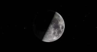 a half-illuminated moon against a black background.