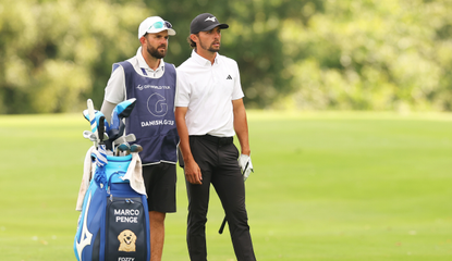 Marco Penge chats to his caddie