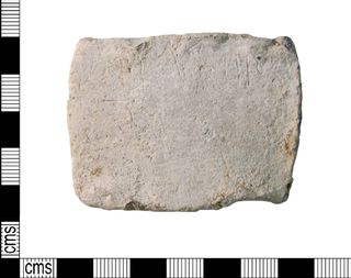 A faint inscription on a lead tablet from the island settlement reads "Cudburg," a female Saxon name.