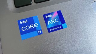 Intel Core i7 and Intel Arc graphics logos on a laptop