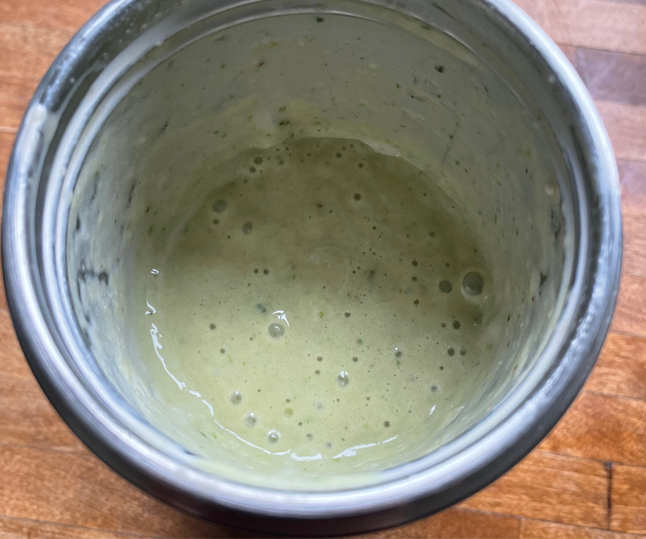 A smooth and creamy green smoothie in the nutribullet Flip&trade; Insulated Portable Blender