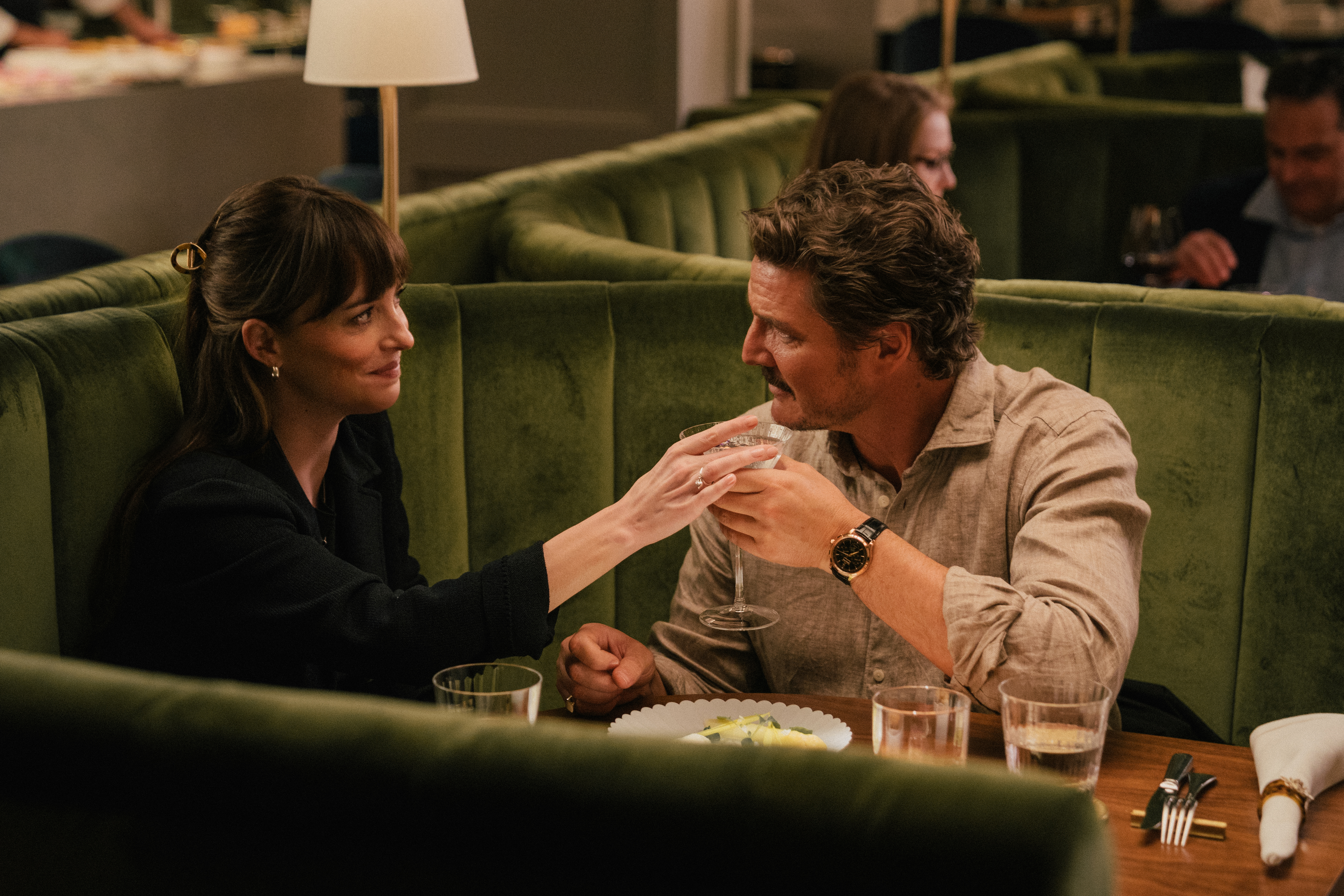 dakota johnson and pedro pascal dining at a luxury restaurant in the movie materialists