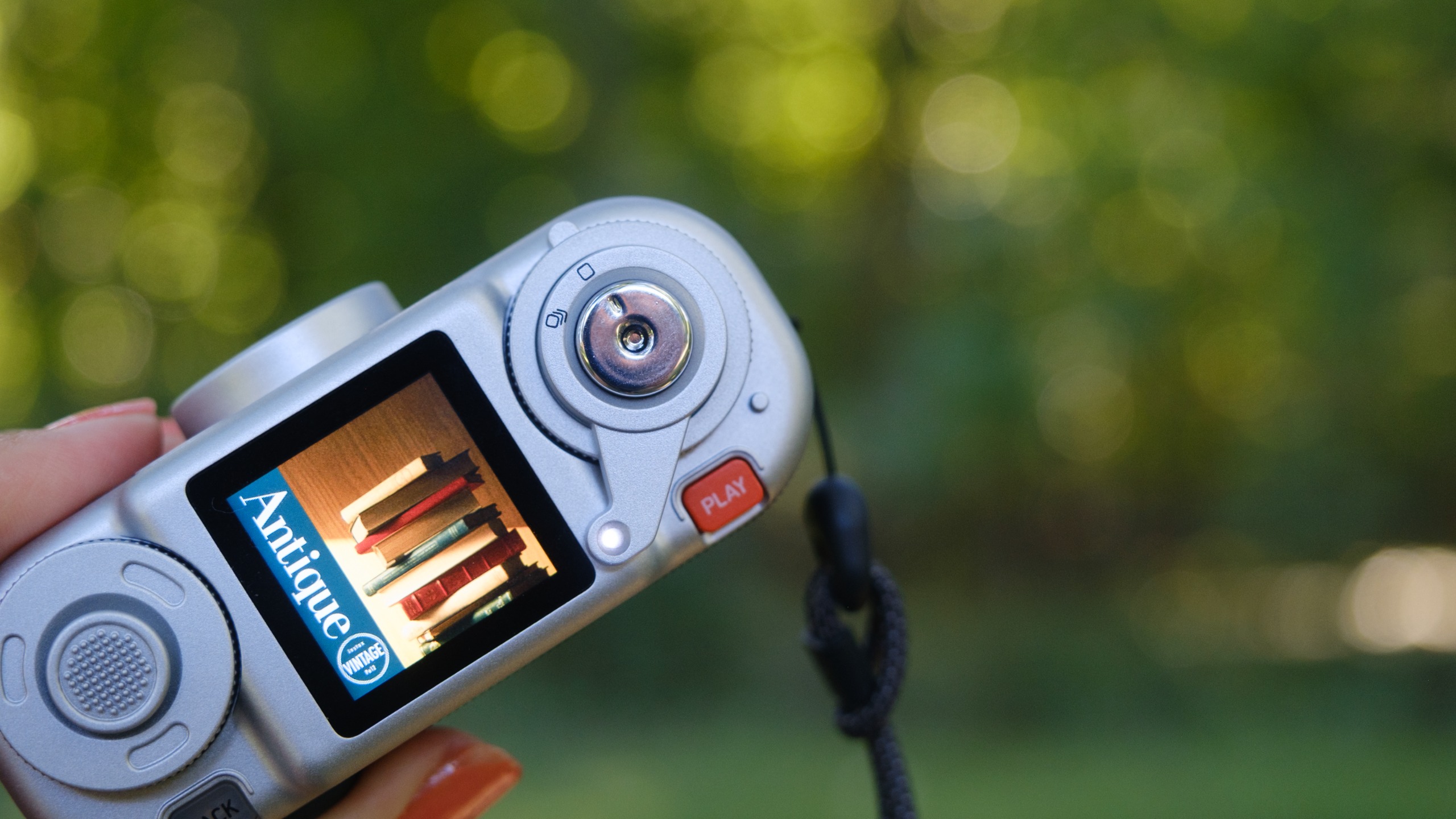 The Instax Pal 2 in a photographer's hands