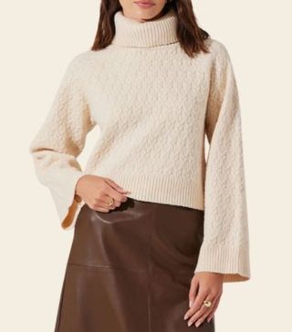 Image of cream turtle neck jumper