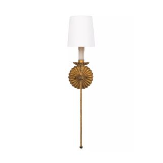 A gold leaf finish wall sconce with an elongated stem and a white lampshade