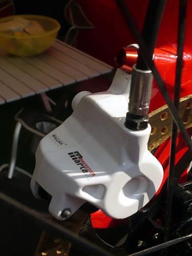Magura's new Marta SL Mag uses a magnesium caliper body instead of aluminum. Sauser's mechanic, Benno Wiliet, makes things even lighter with anodized aluminum hardware.