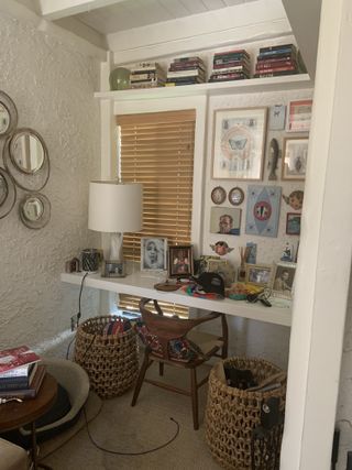 A living room alcove with a desk