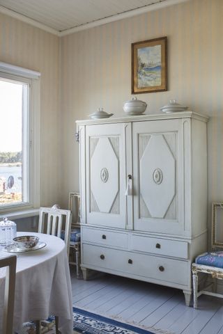 Gustavian style cabinet in a Swedish traditional summer home on an island